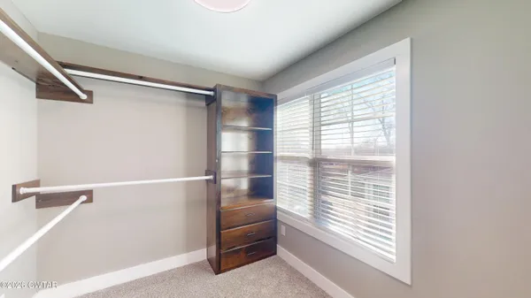 an empty room that has a window