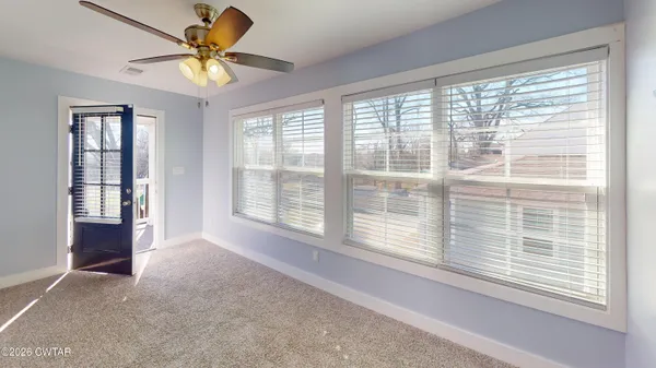 a view of an empty room with a window