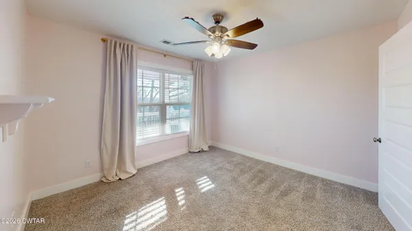 a view of a livingroom with wooden floor and closet