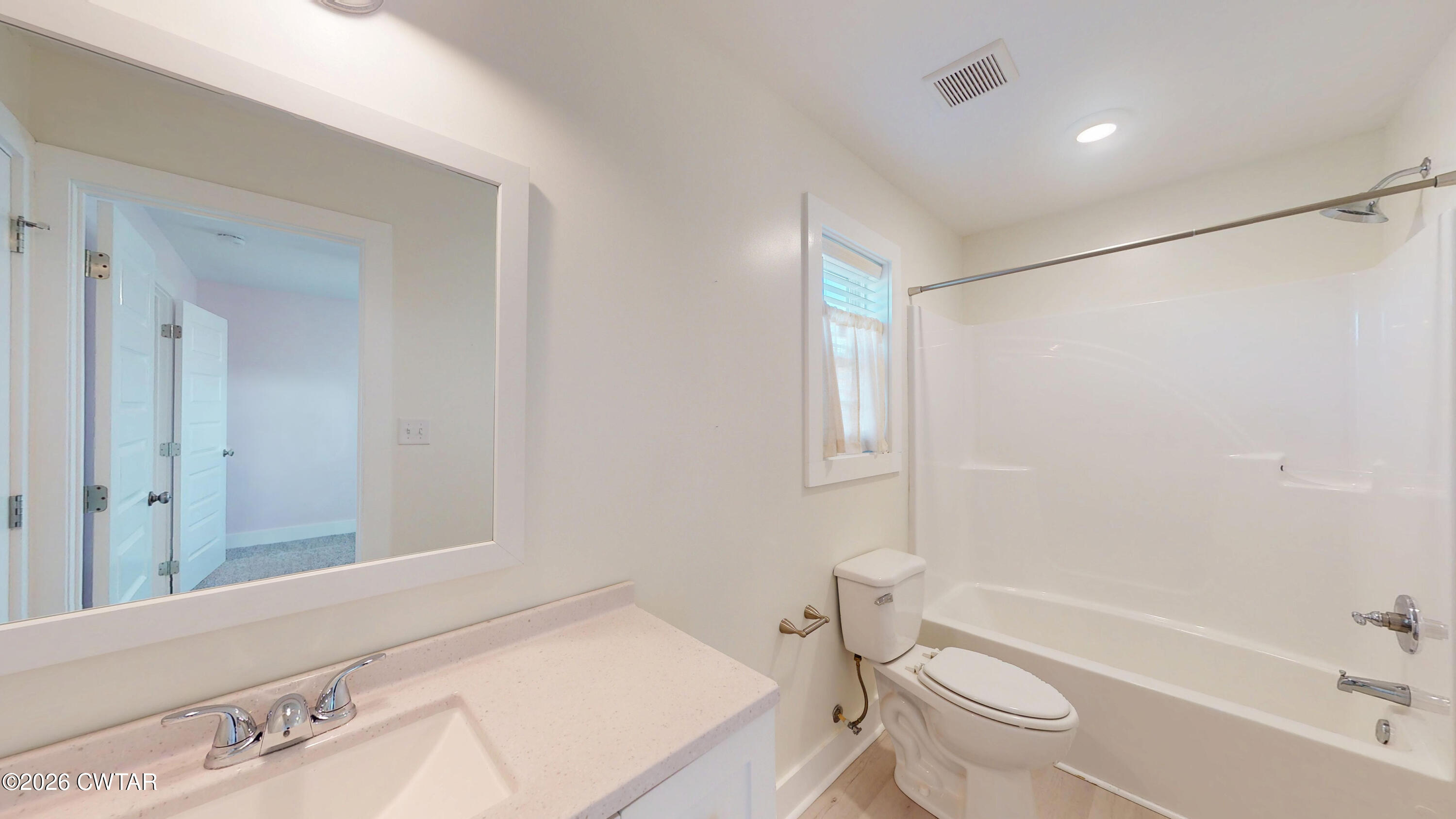 226 Morgan Street Jackson, TN 38301 - Photo 33 of 51 a bathroom with a sink a toilet a vanity and shower