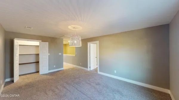 an empty room with a empty space and windows