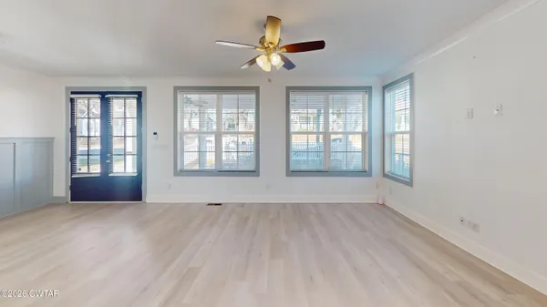 a view of an empty room with a window