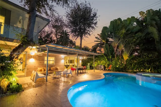 a view of a swimming pool with a patio