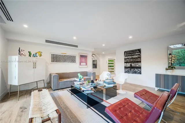 a living room with furniture and a table