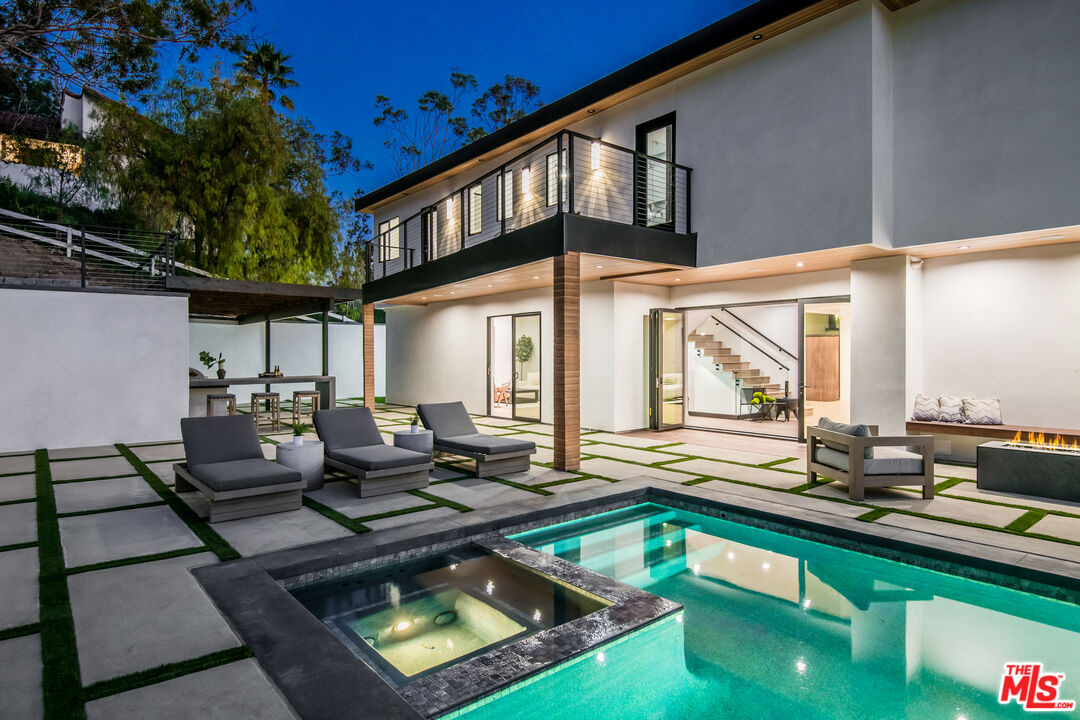26 Baymare Road Bell Canyon, CA 91307 - Photo 2 of 39 a view of a house with pool chairs and couches