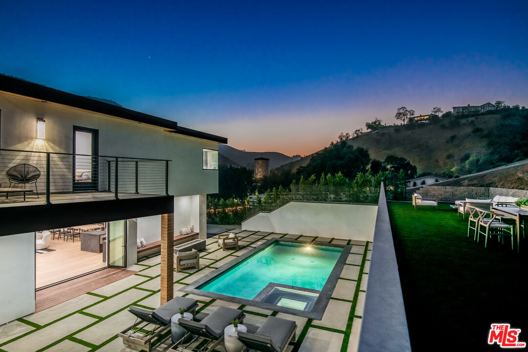 26 Baymare Road Bell Canyon, CA 91307 - Photo 3 of 39 a view of a patio with chairs under an umbrella