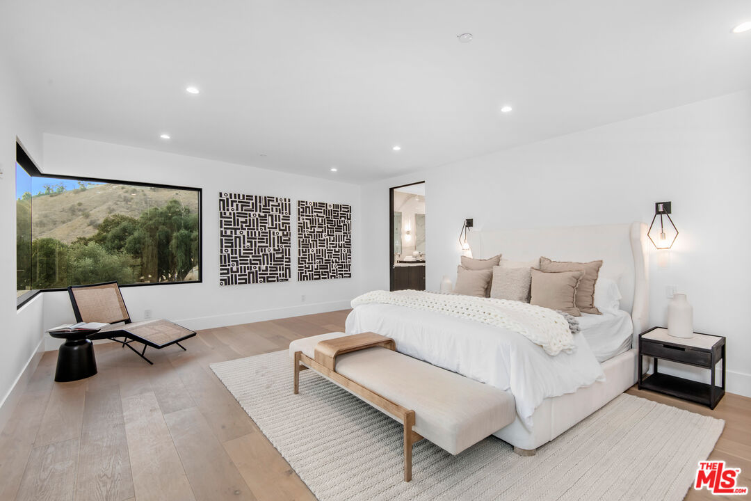 26 Baymare Road Bell Canyon, CA 91307 - Photo 23 of 39 a spacious bedroom with a bed and large windows