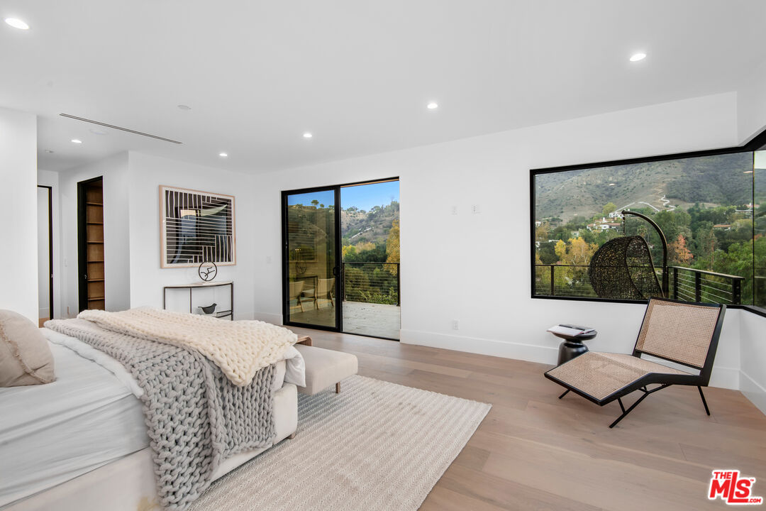26 Baymare Road Bell Canyon, CA 91307 - Photo 24 of 39 a living room with a large window and a flat screen tv