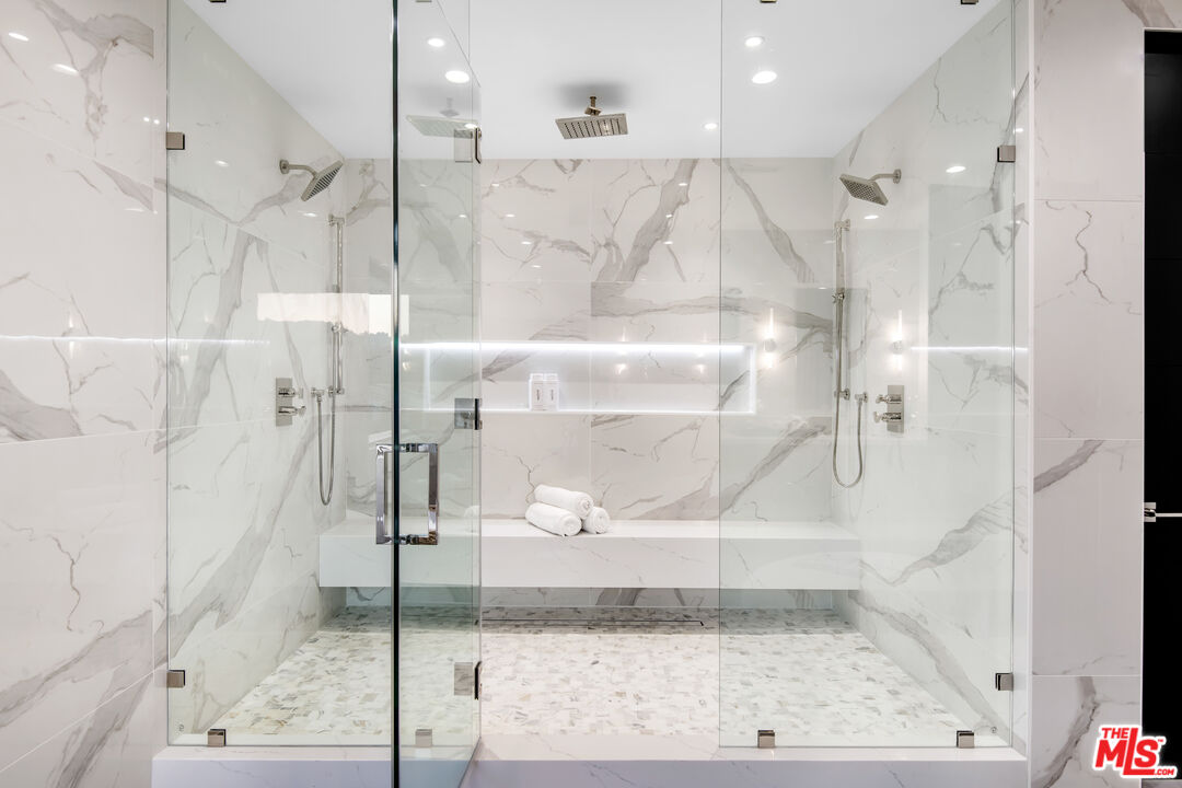 26 Baymare Road Bell Canyon, CA 91307 - Photo 25 of 39 a bathroom with a glass shower door