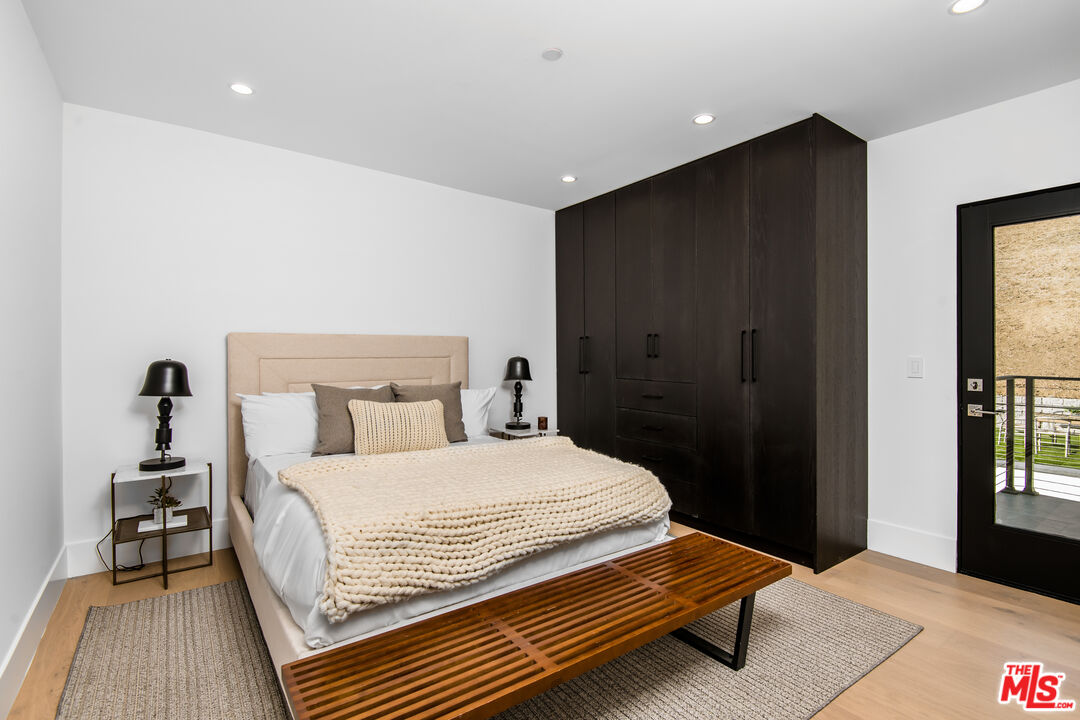 26 Baymare Road Bell Canyon, CA 91307 - Photo 28 of 39 a bedroom with a bed and wooden floor