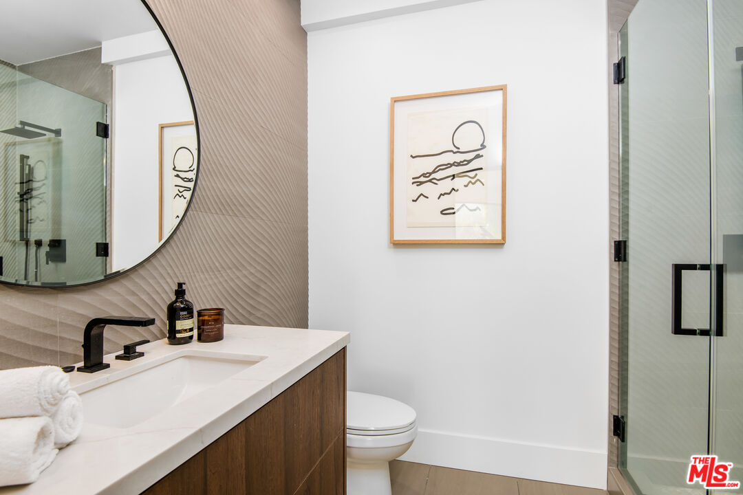26 Baymare Road Bell Canyon, CA 91307 - Photo 29 of 39 a bathroom with a sink a toilet and a mirror