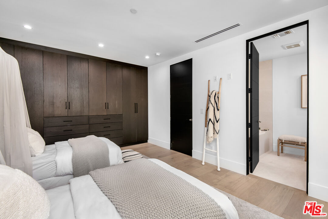 26 Baymare Road Bell Canyon, CA 91307 - Photo 30 of 39 a bedroom with a bed and a walk in closet