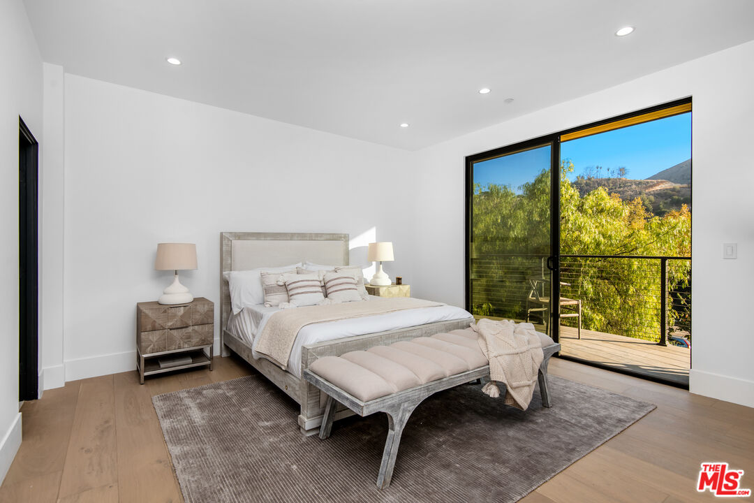 26 Baymare Road Bell Canyon, CA 91307 - Photo 32 of 39 a bedroom with a bed and a large window