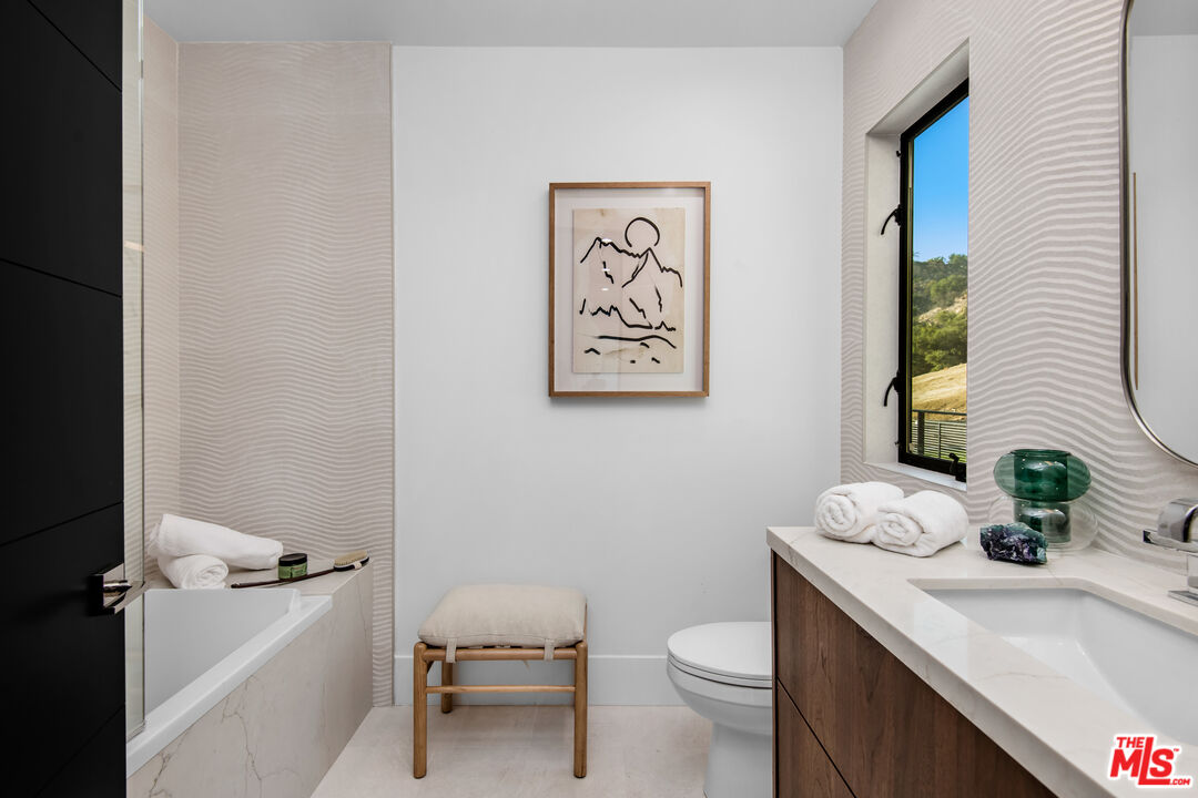 26 Baymare Road Bell Canyon, CA 91307 - Photo 33 of 39 a bathroom with a toilet a sink and mirror