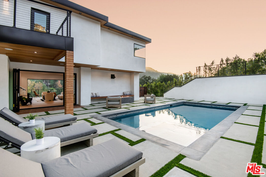 26 Baymare Road Bell Canyon, CA 91307 - Photo 37 of 39 a view of a patio with couches table and chairs with wooden floor and fence