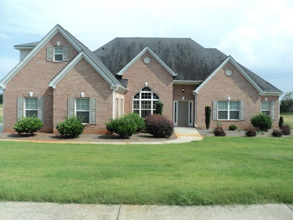 Beautiful ranch with bonus room on large level lot.