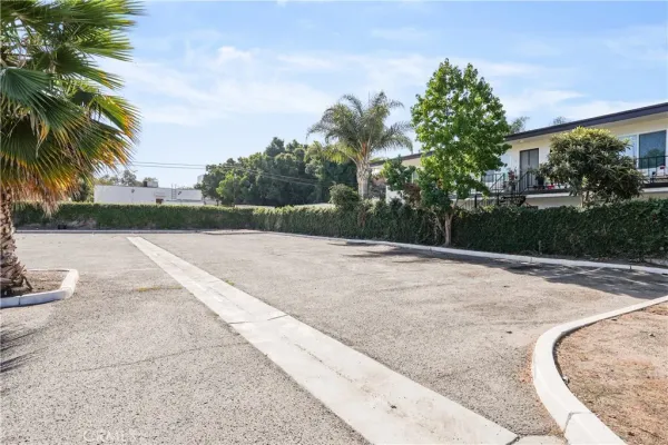 a view of parking with cars parked