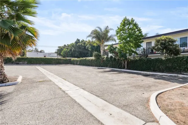 a view of parking with cars parked