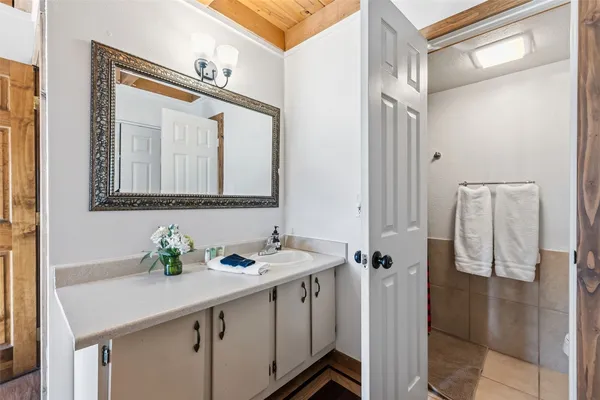 a bathroom with a sink and a mirror