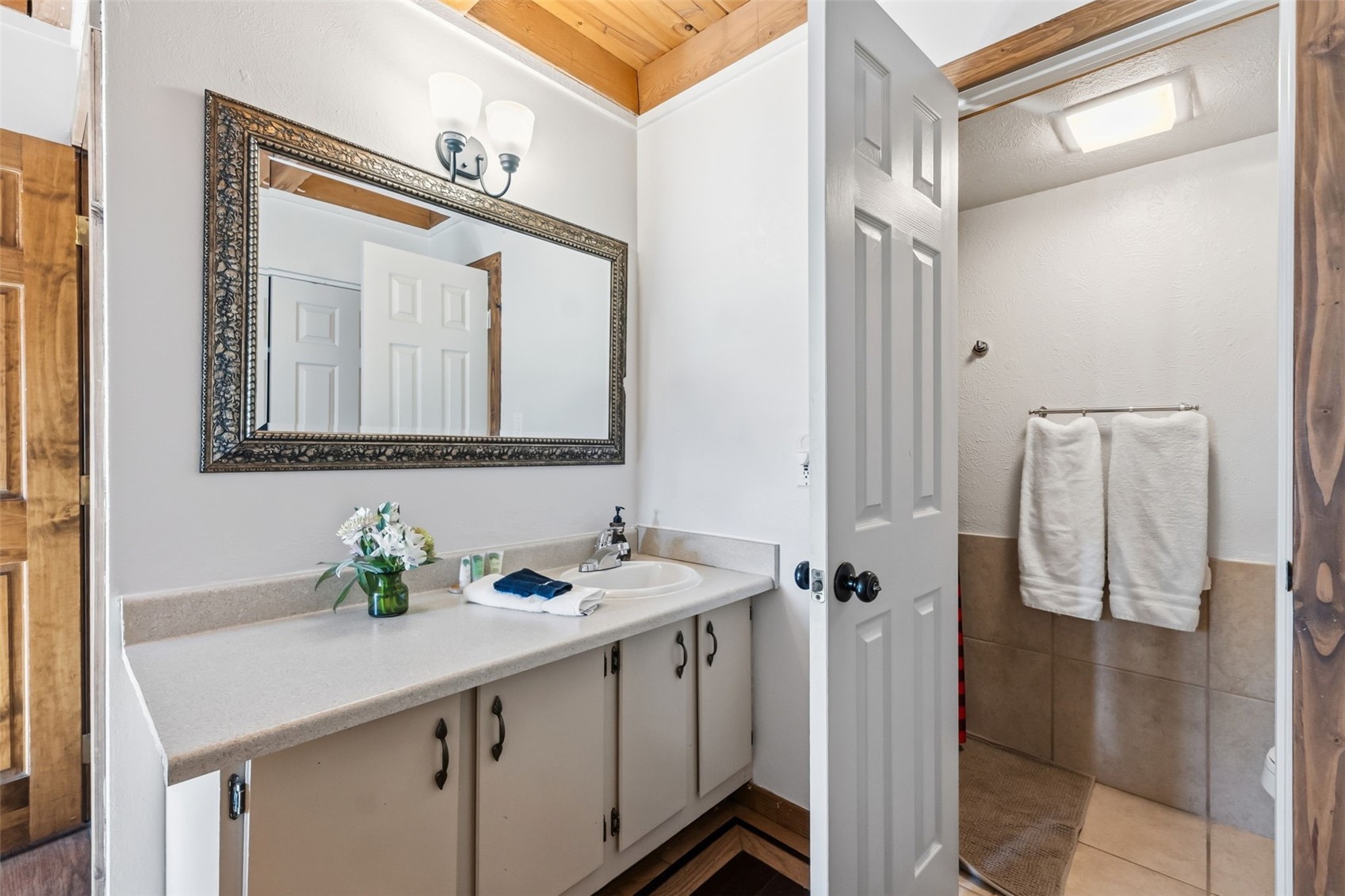 8500 Ryan Gulch Road, Unit 206 Silverthorne, CO 80498 - Photo 16 of 34 a bathroom with a sink and a mirror