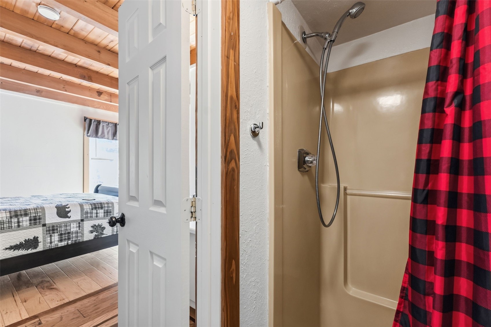 8500 Ryan Gulch Road, Unit 206 Silverthorne, CO 80498 - Photo 17 of 34 a bathroom with a bathtub and a shower