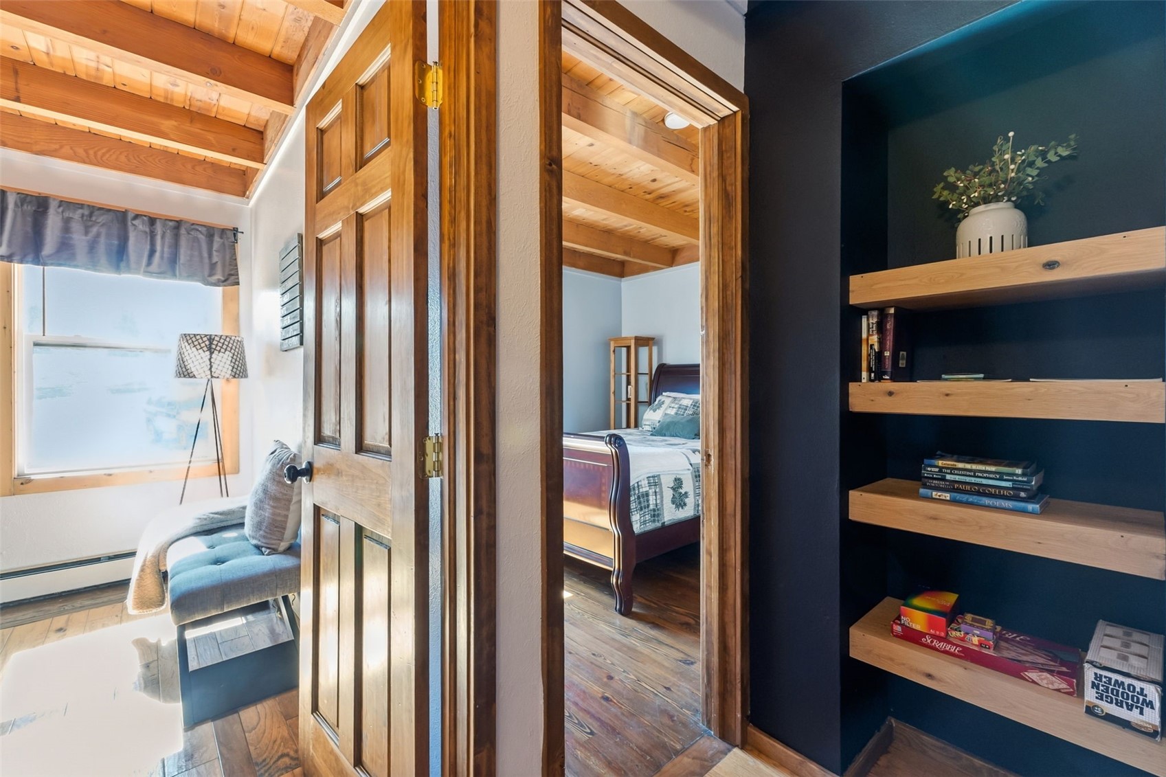 8500 Ryan Gulch Road, Unit 206 Silverthorne, CO 80498 - Photo 18 of 34 a view of a hallway to a livingroom with furniture