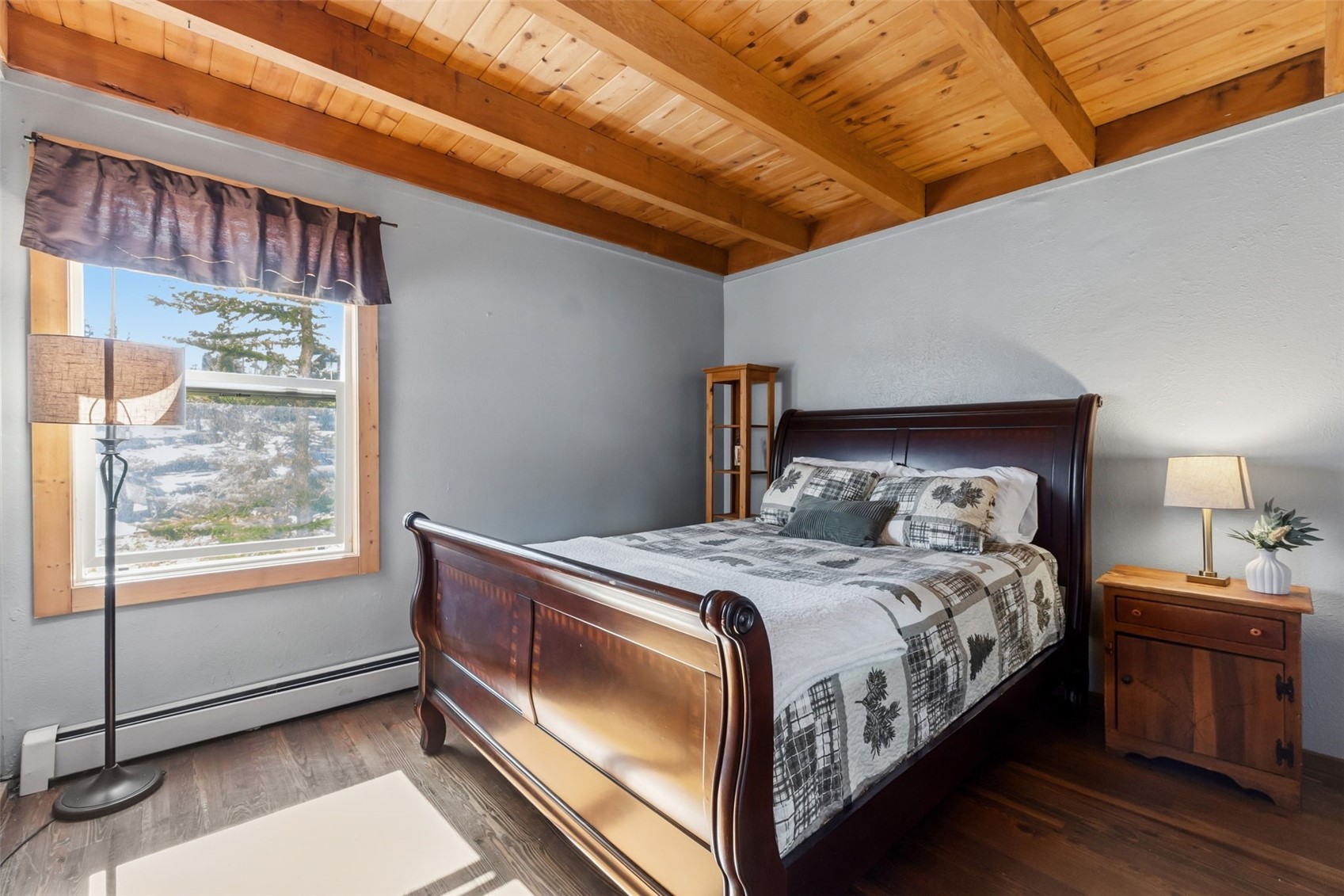 8500 Ryan Gulch Road, Unit 206 Silverthorne, CO 80498 - Photo 19 of 34 a bedroom with a bed and a window