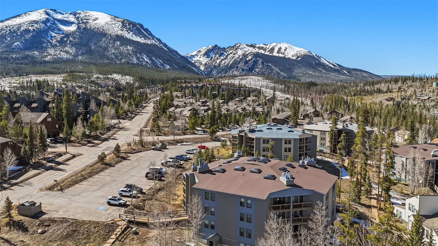 8500 Ryan Gulch Road, Unit 206 Silverthorne, CO 80498 - Photo 2 of 34 a view of a large building with a mountain in the background