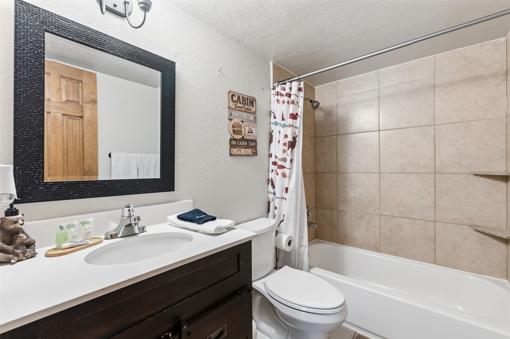 8500 Ryan Gulch Road, Unit 206 Silverthorne, CO 80498 - Photo 21 of 34 a bathroom with a sink a toilet and shower