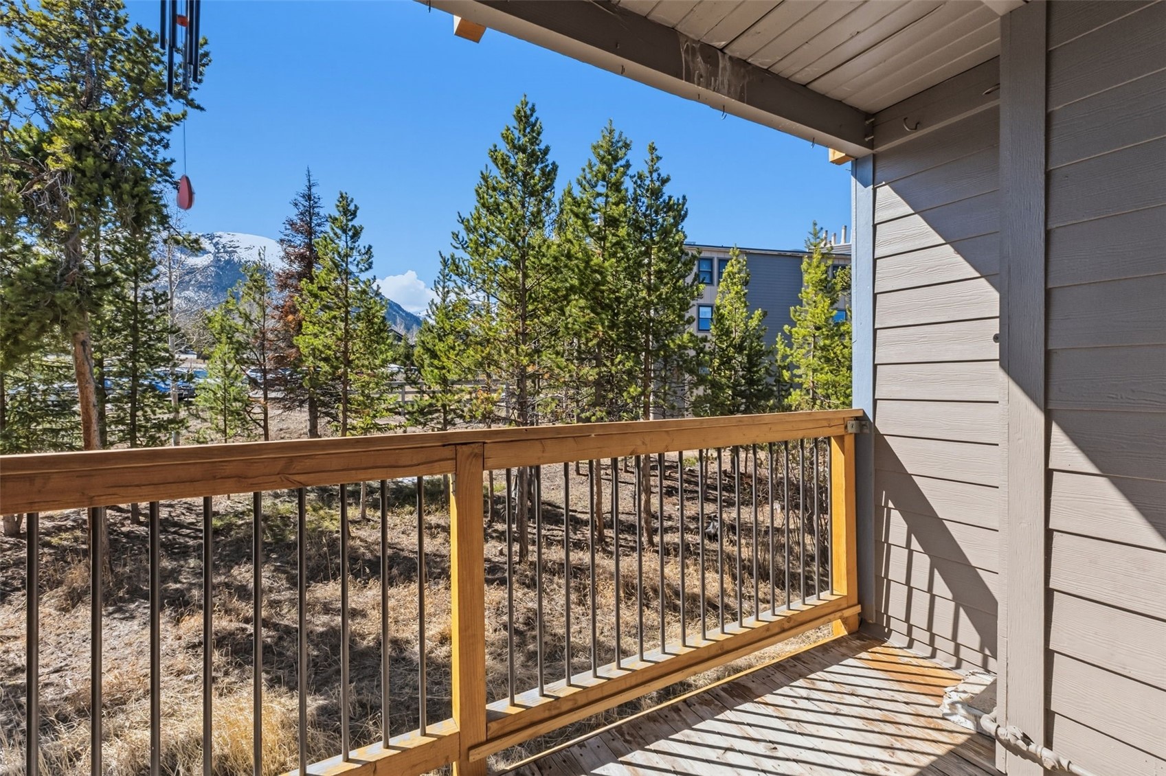 8500 Ryan Gulch Road, Unit 206 Silverthorne, CO 80498 - Photo 24 of 34 a view of a balcony with wooden floor