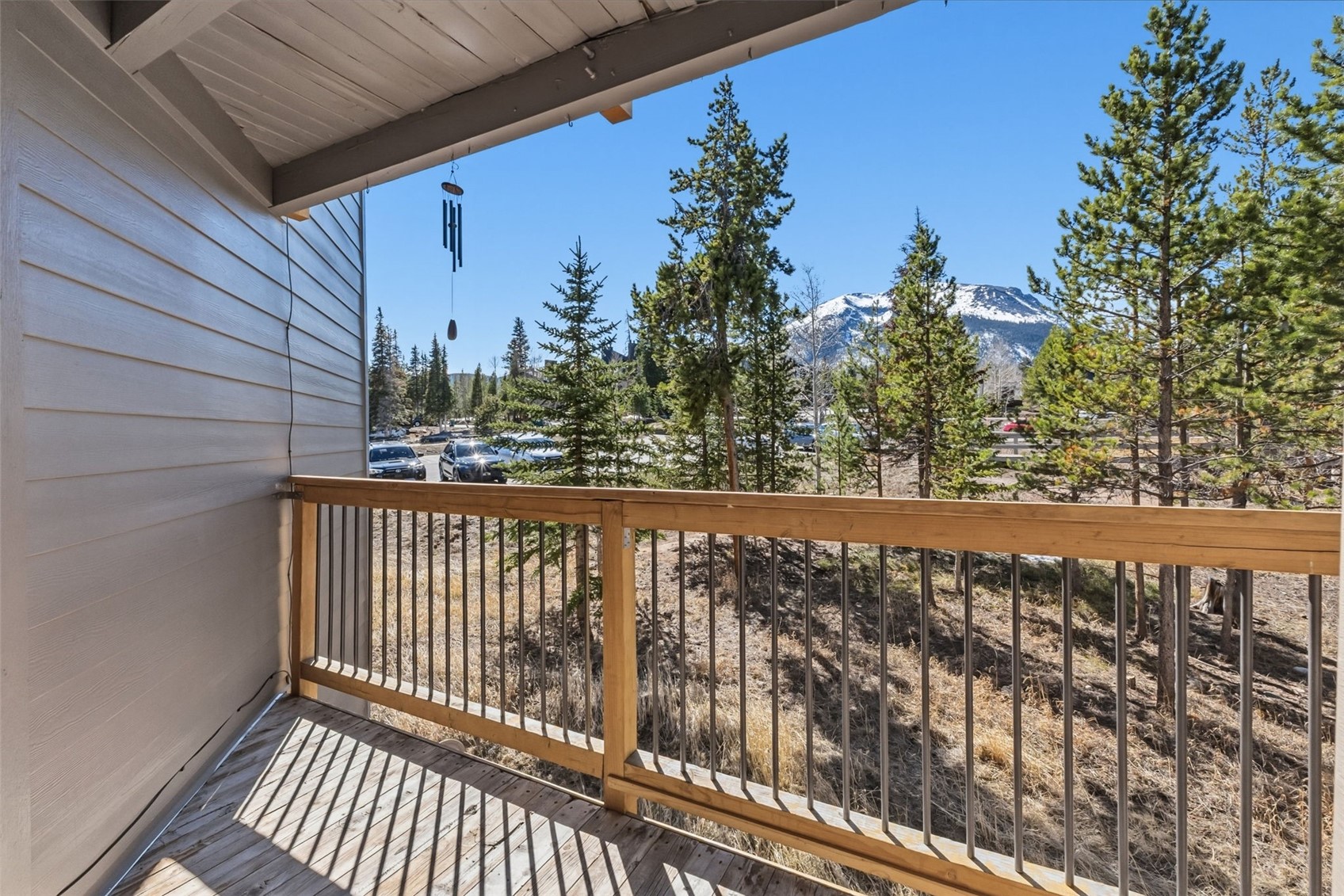 8500 Ryan Gulch Road, Unit 206 Silverthorne, CO 80498 - Photo 3 of 34 a view of a balcony with wooden fence