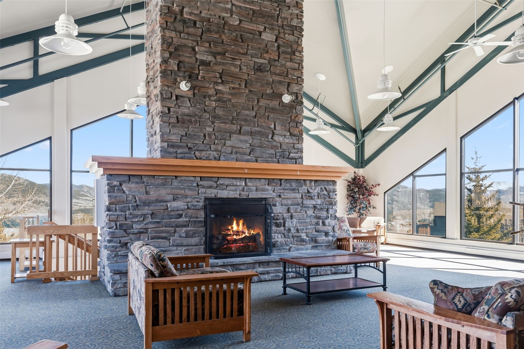 8500 Ryan Gulch Road, Unit 206 Silverthorne, CO 80498 - Photo 32 of 34 a living room with furniture and a fireplace