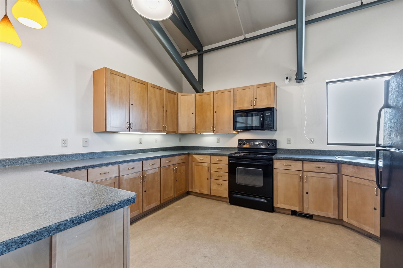 8500 Ryan Gulch Road, Unit 206 Silverthorne, CO 80498 - Photo 34 of 34 a kitchen with stainless steel appliances granite countertop a sink stove and microwave