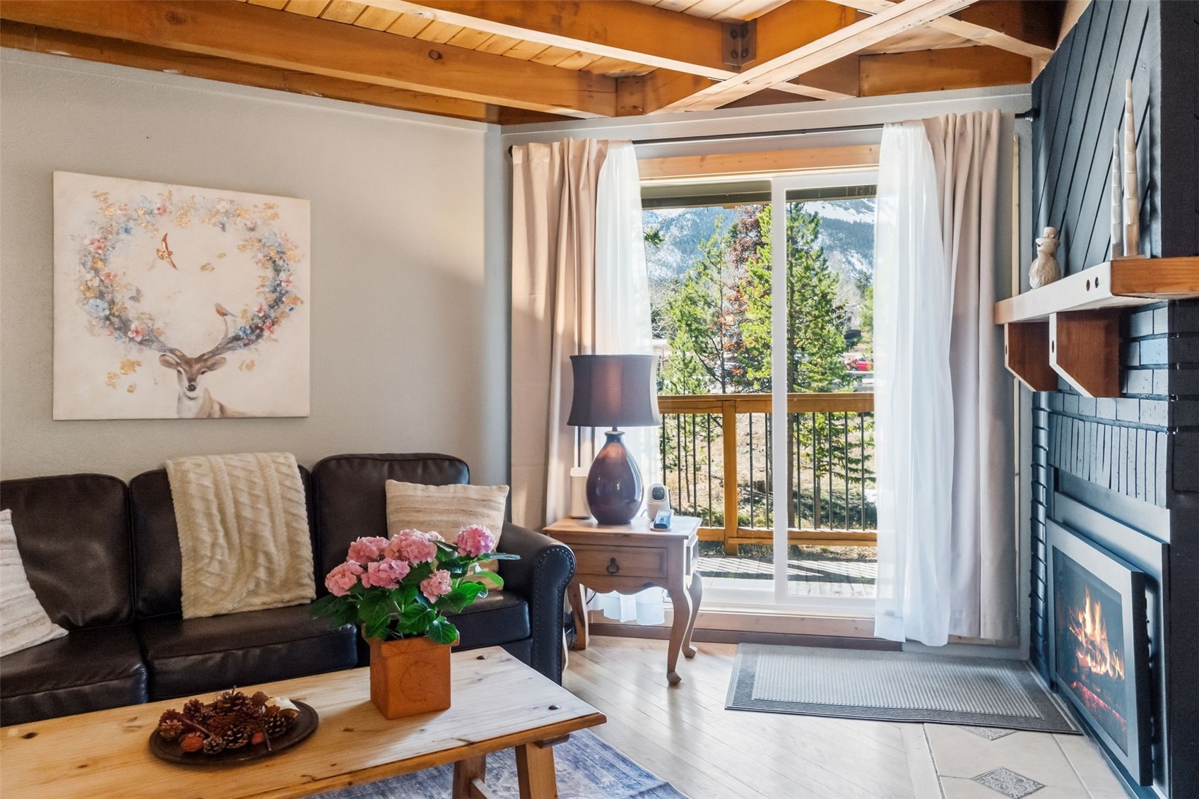 8500 Ryan Gulch Road, Unit 206 Silverthorne, CO 80498 - Photo 5 of 34 a living room with furniture and a potted plant