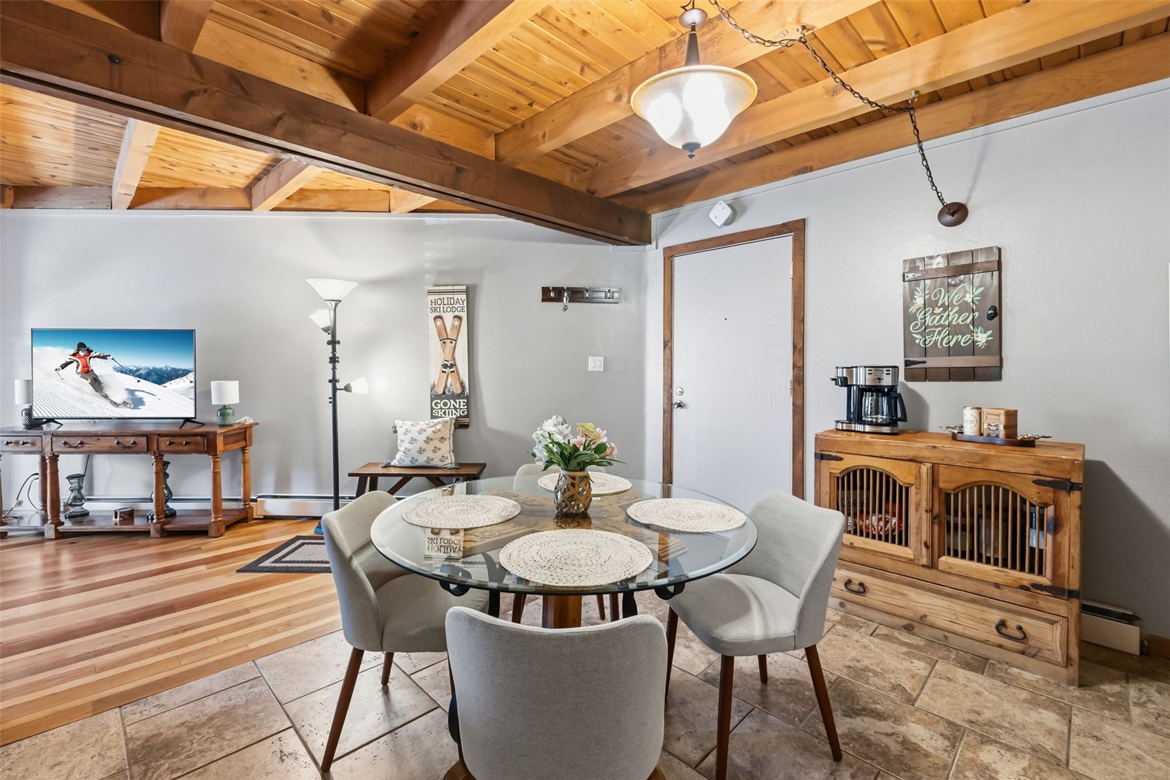 8500 Ryan Gulch Road, Unit 206 Silverthorne, CO 80498 - Photo 8 of 34 a view of a dining room with furniture and wooden floor