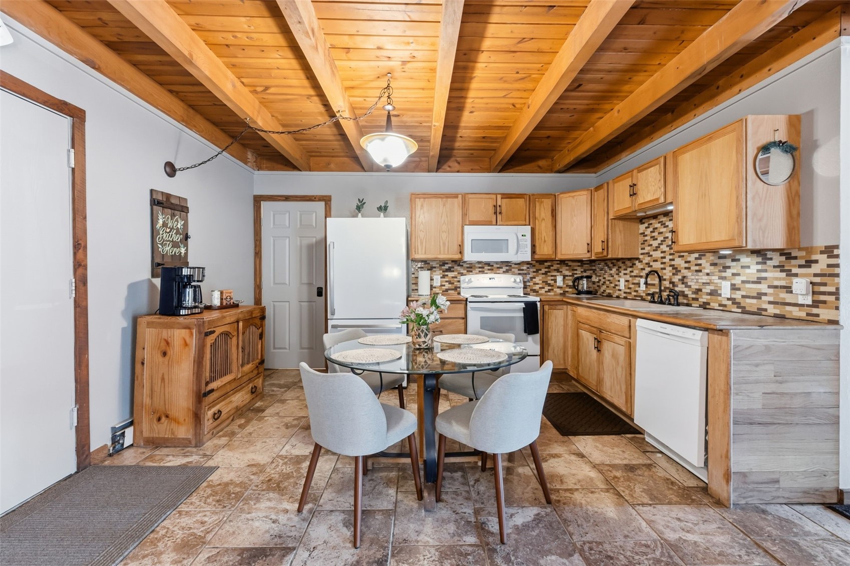 8500 Ryan Gulch Road, Unit 206 Silverthorne, CO 80498 - Photo 10 of 34 a view of a dining room with furniture