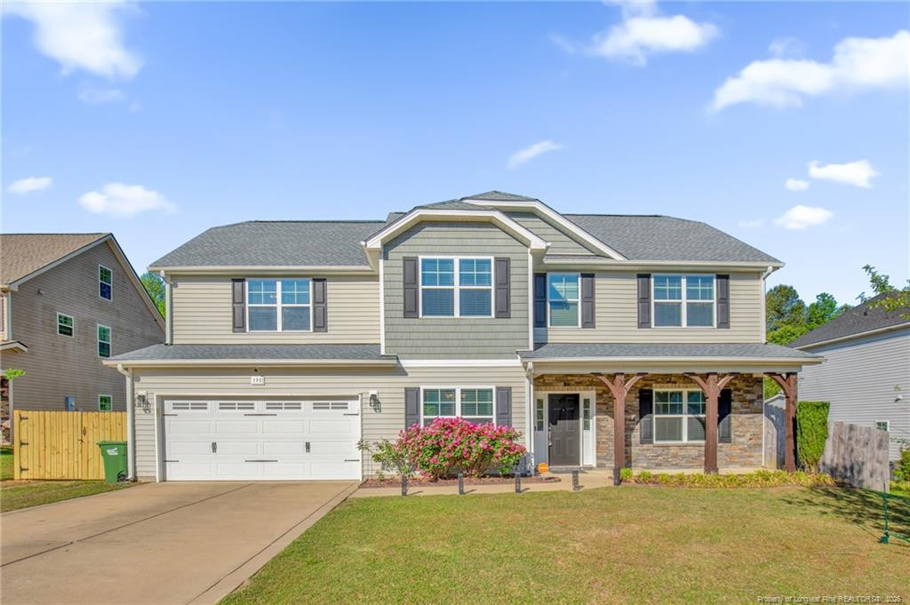 132 Shellbark Drive Spring Lake, NC 28390 - Photo 1 of 44 a front view of a house with yellow lighting