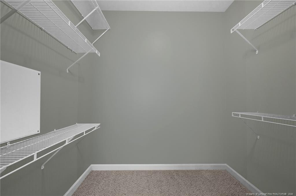 132 Shellbark Drive Spring Lake, NC 28390 - Photo 23 of 44 a view of a room with racks on the wall