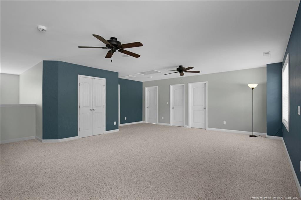 132 Shellbark Drive Spring Lake, NC 28390 - Photo 24 of 44 a view of a big room with chandelier fan and windows