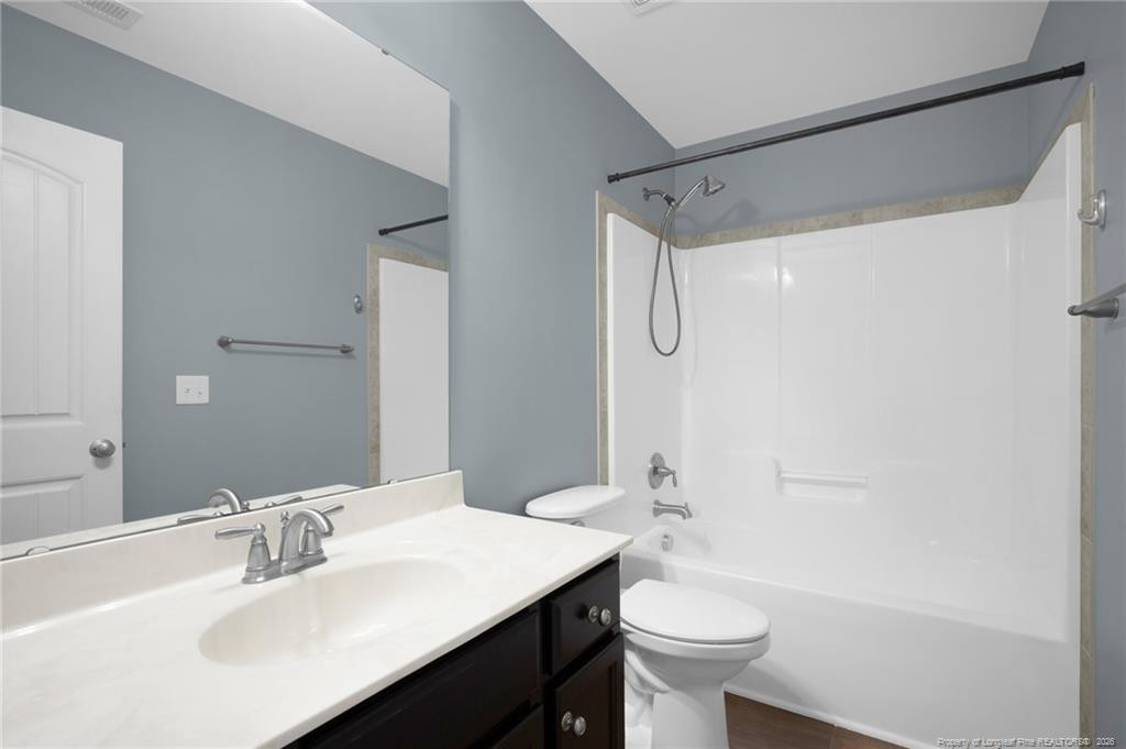 132 Shellbark Drive Spring Lake, NC 28390 - Photo 29 of 44 a bathroom with a sink a toilet and shower