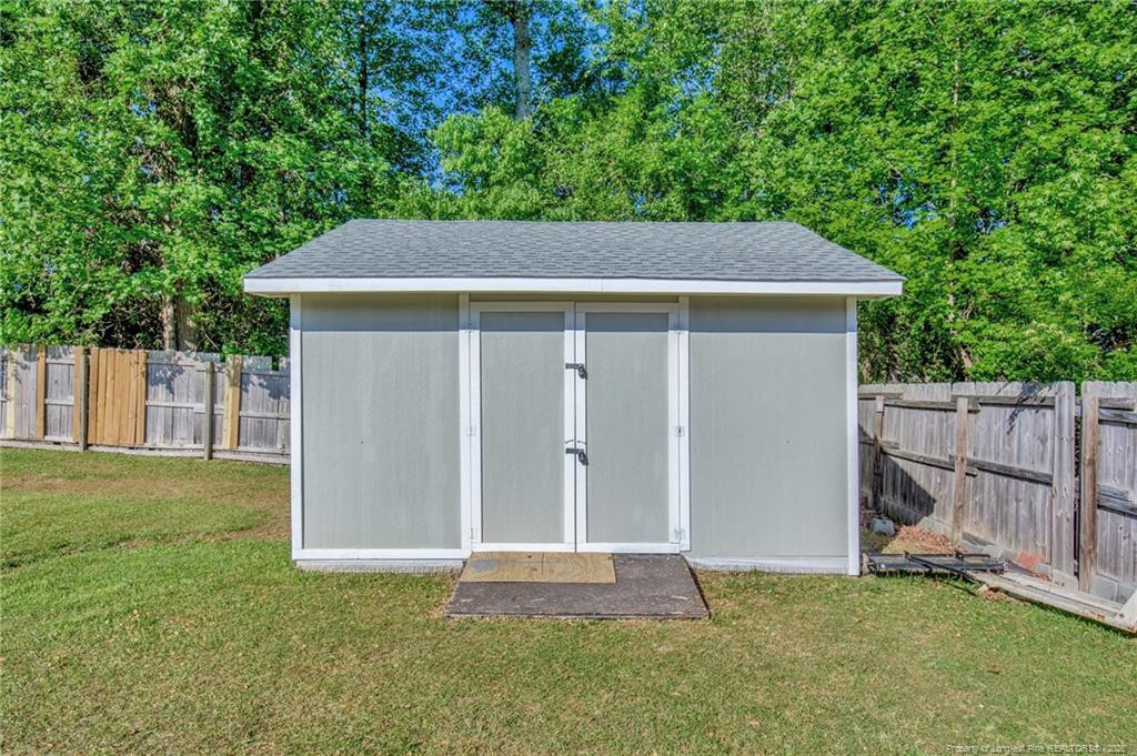 132 Shellbark Drive Spring Lake, NC 28390 - Photo 43 of 44 a backyard of a house with lots of green space