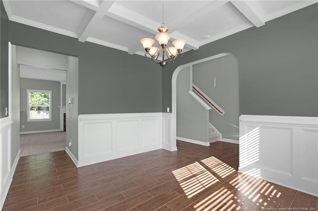 132 Shellbark Drive Spring Lake, NC 28390 - Photo 7 of 44 a view of a hallway with wooden floor and staircase