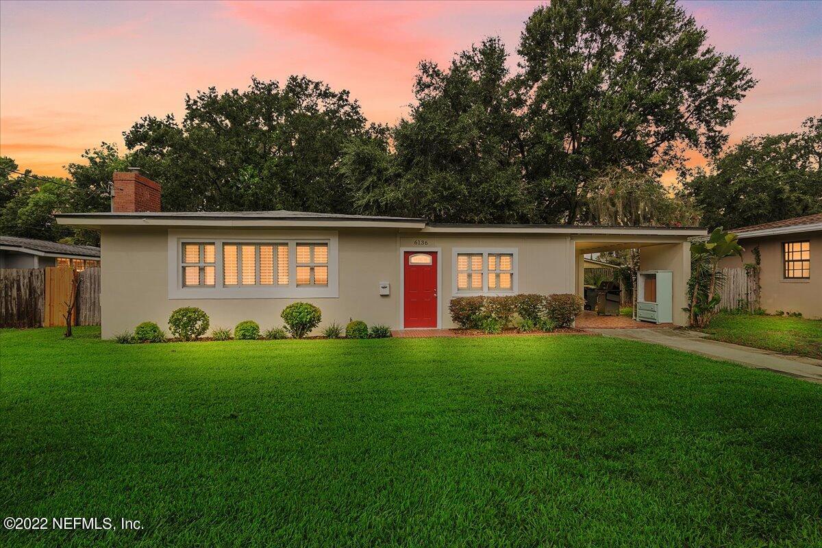 6136 Duke Road Jacksonville, FL 32217 - Photo 1 of 23 a front view of a house with a garden