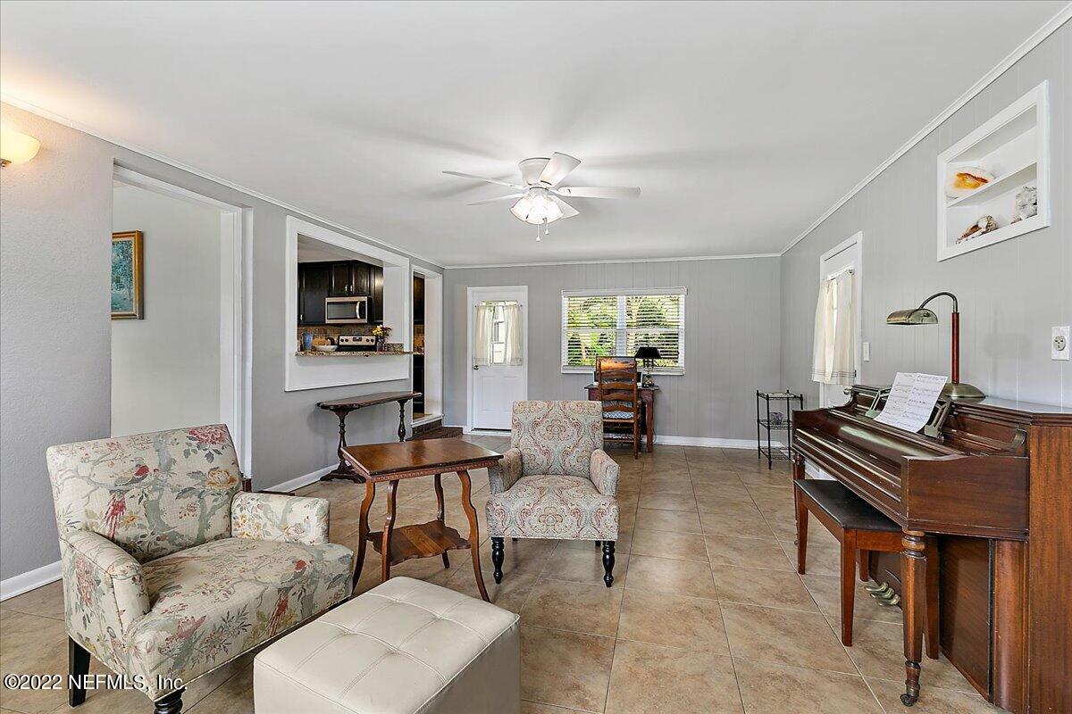 6136 Duke Road Jacksonville, FL 32217 - Photo 12 of 23 a living room with furniture and a flat screen tv