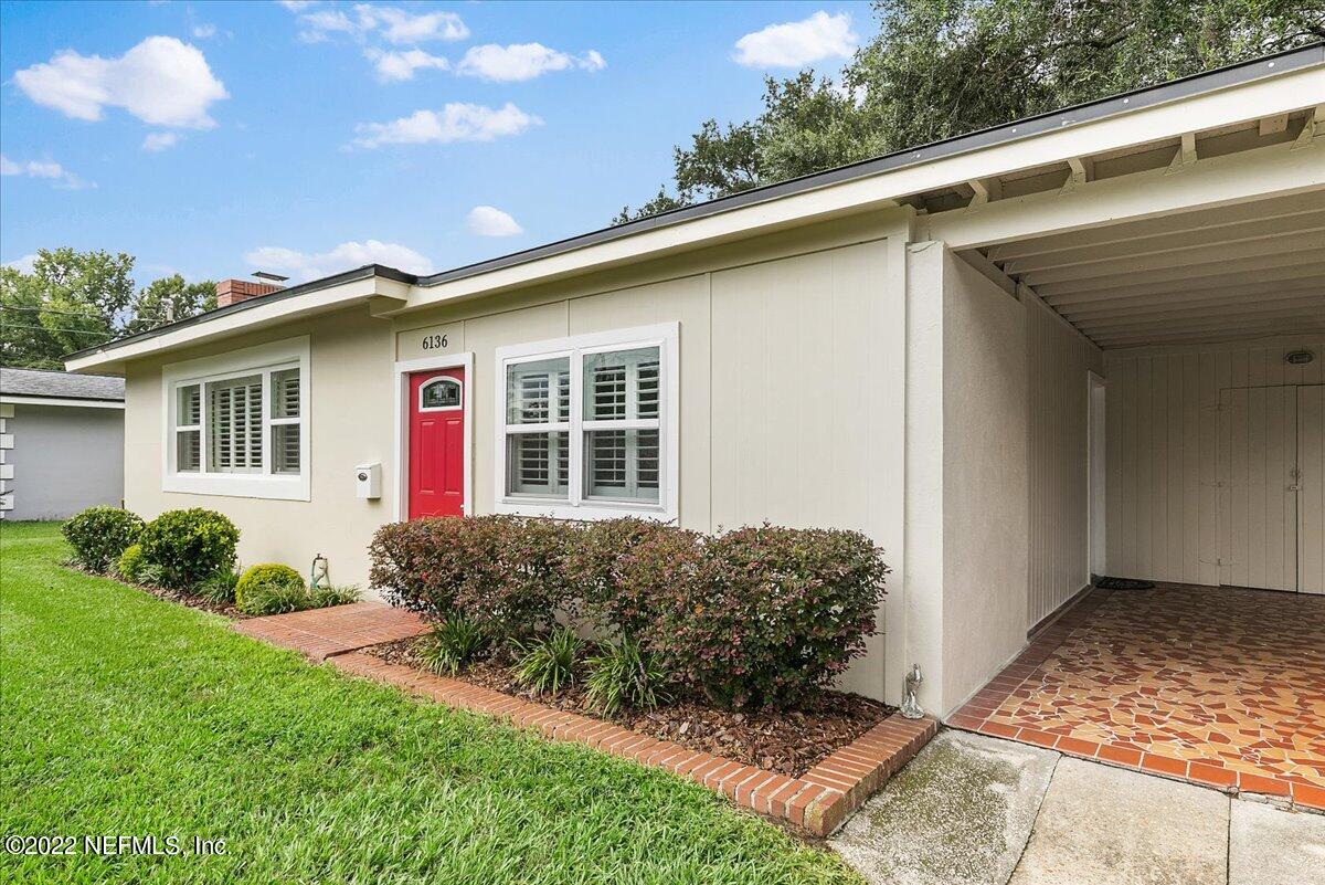 6136 Duke Road Jacksonville, FL 32217 - Photo 2 of 23 a front view of a house with a yard