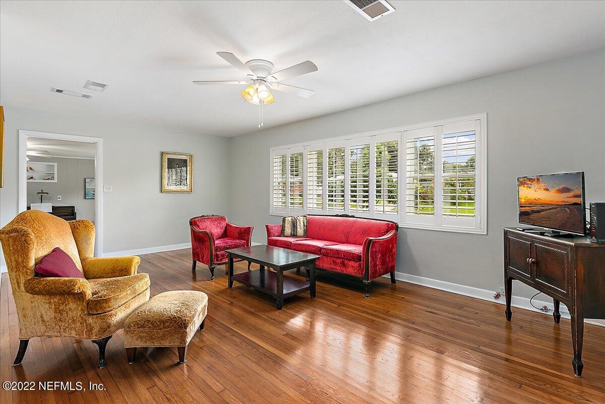 6136 Duke Road Jacksonville, FL 32217 - Photo 3 of 23 a living room with furniture and wooden floor