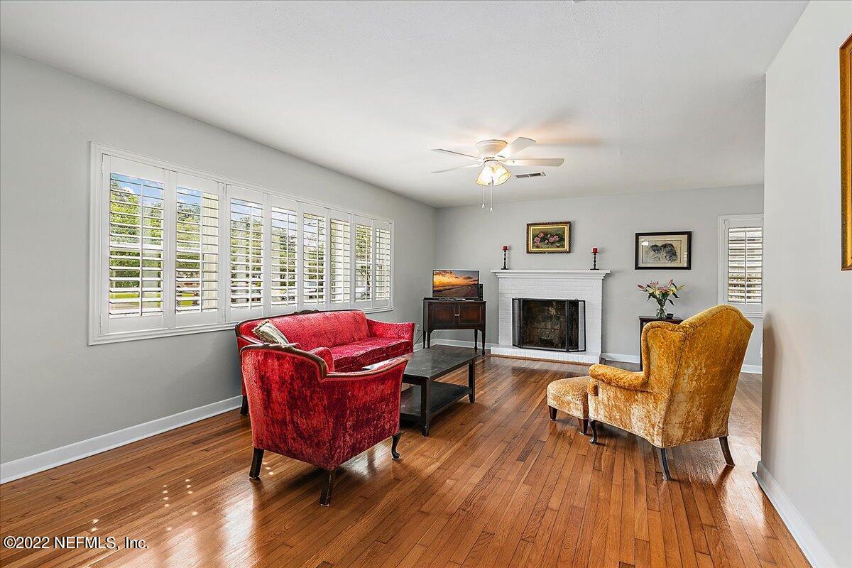 6136 Duke Road Jacksonville, FL 32217 - Photo 4 of 23 a living room with furniture and a fireplace
