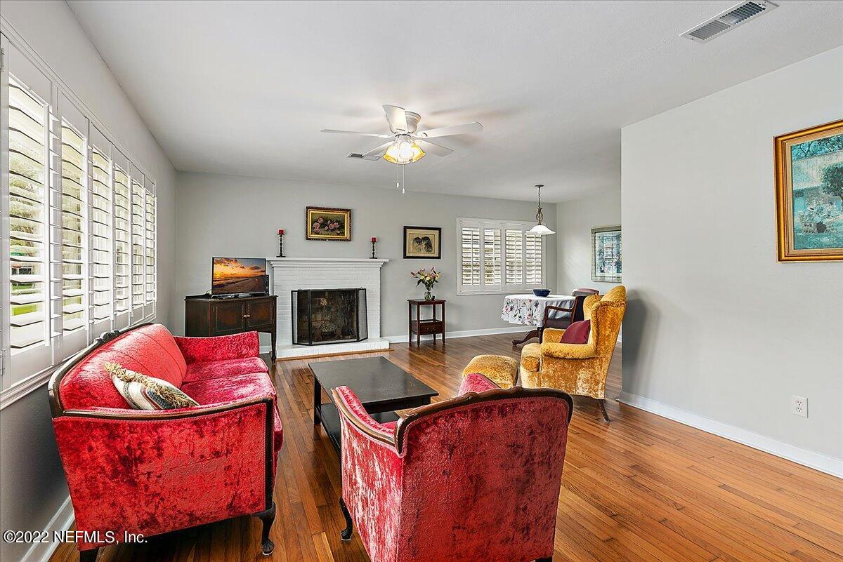 6136 Duke Road Jacksonville, FL 32217 - Photo 5 of 23 a living room with furniture and a fireplace