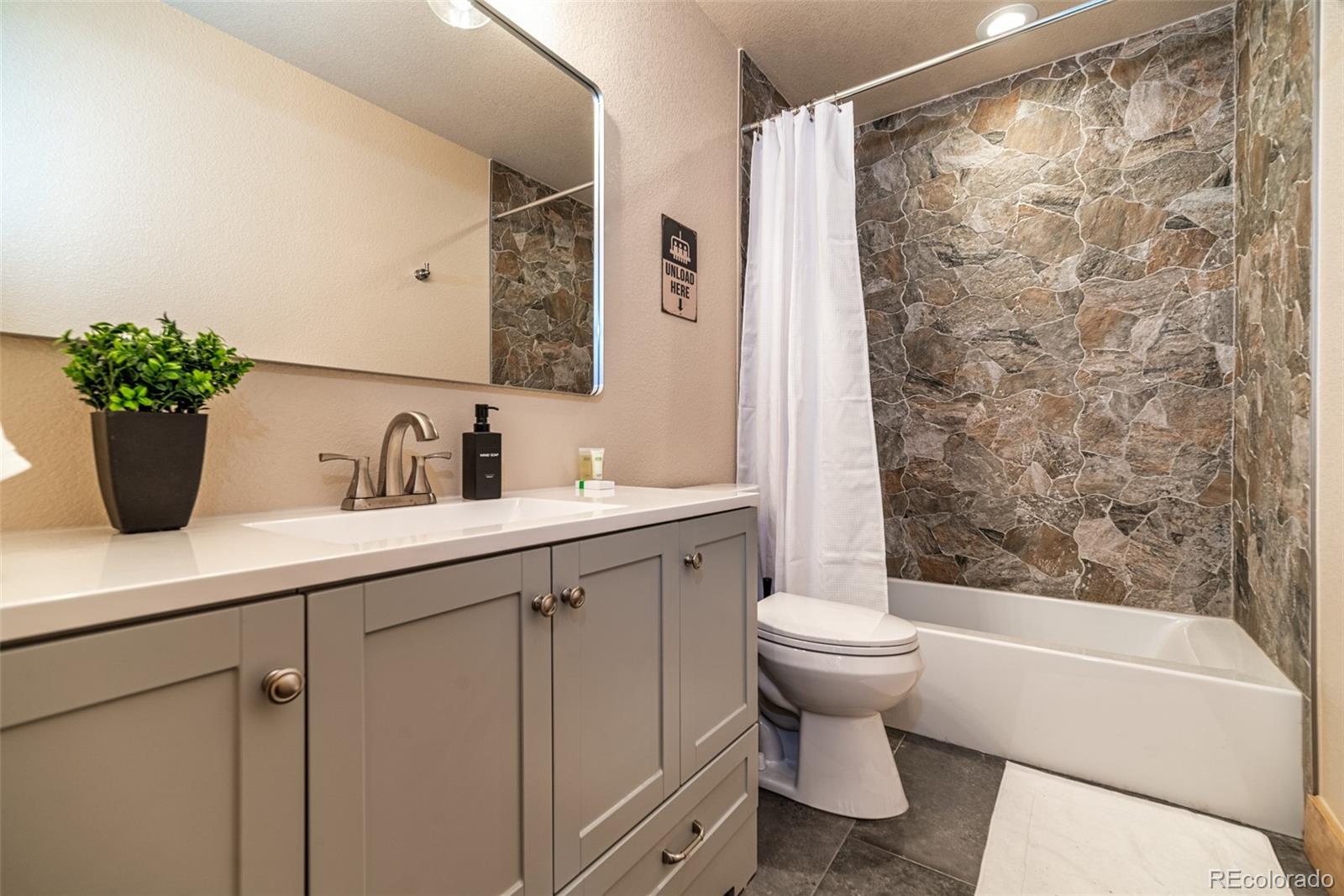526 Porcupine Road Fairplay, CO 80440 - Photo 19 of 46 a bathroom with a sink toilet and shower