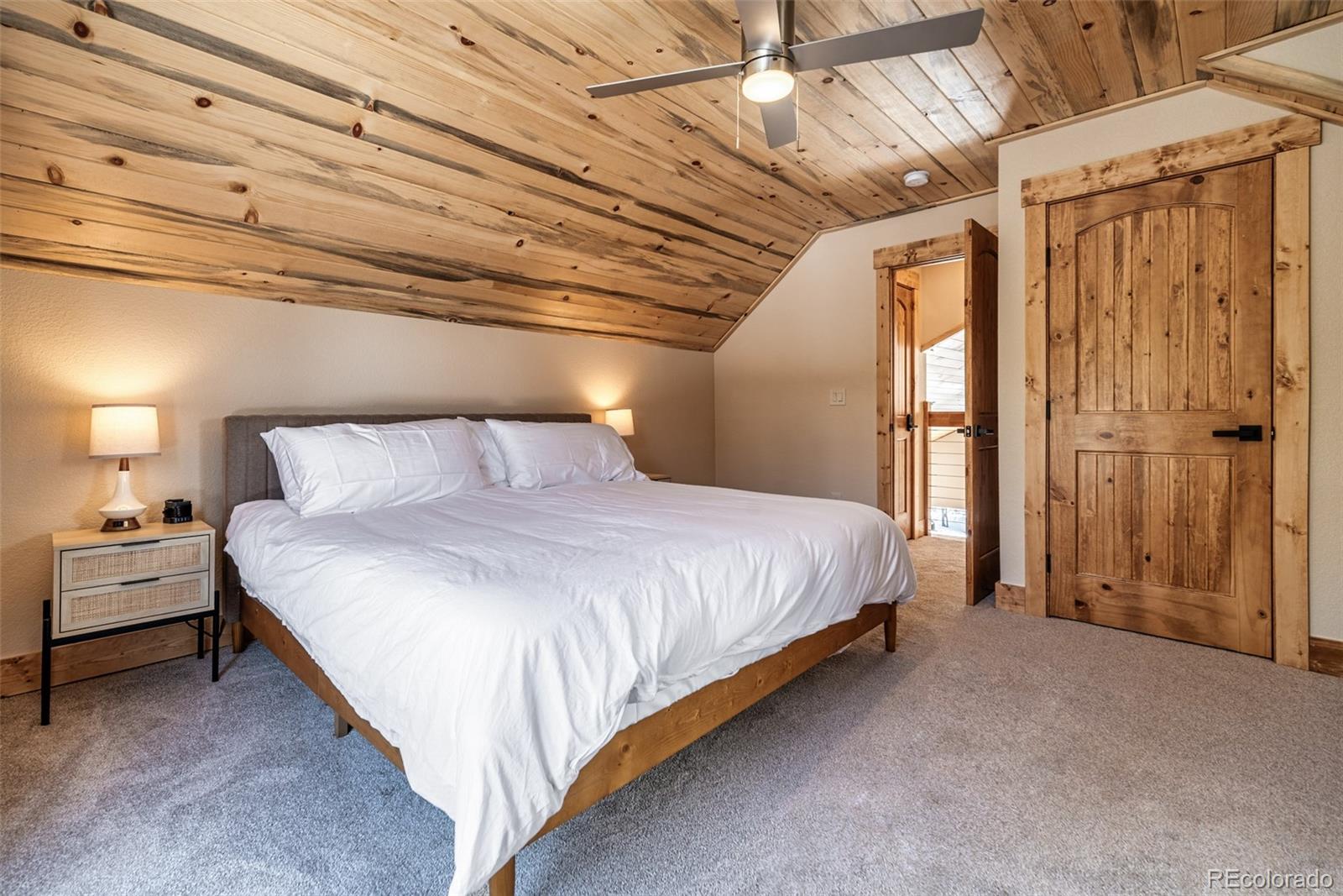 526 Porcupine Road Fairplay, CO 80440 - Photo 24 of 46 a bed sitting in a bedroom next to a window